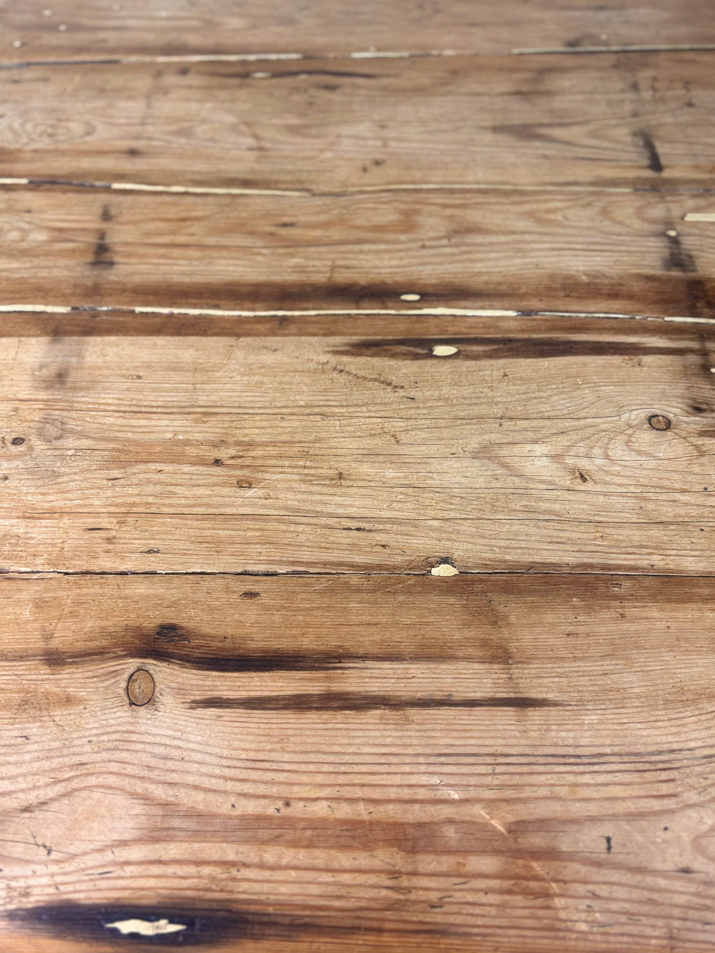 A worn wooden table top