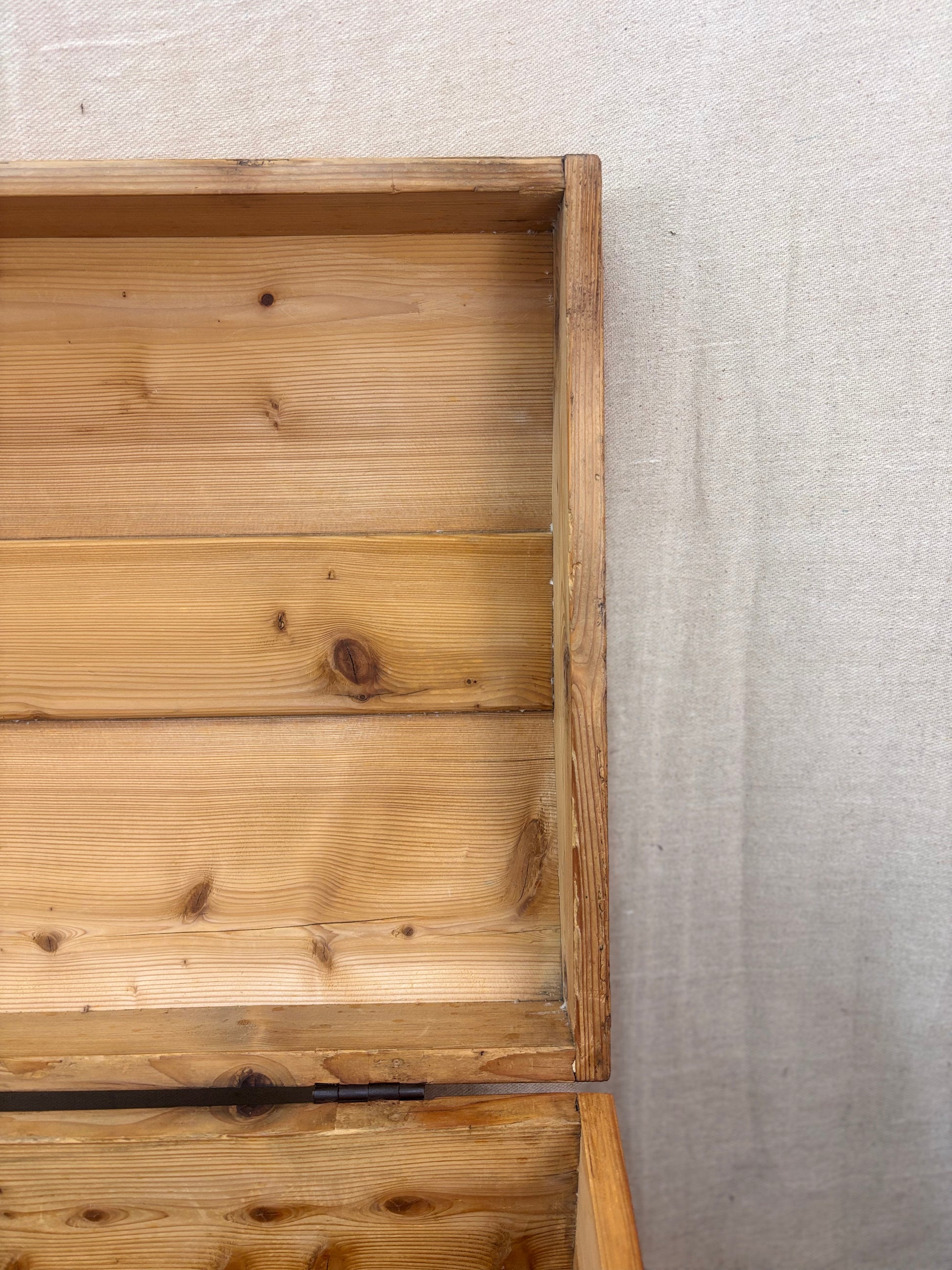 Wooden crate with a textured gray background