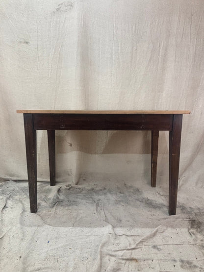 Wooden table against a plain background