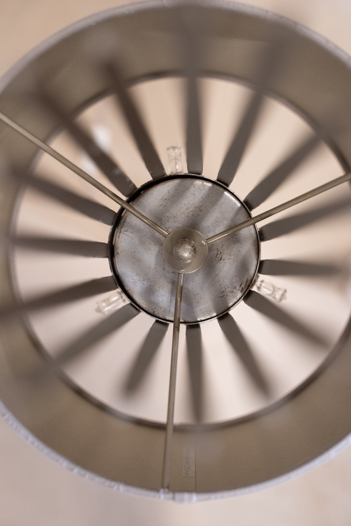 Pair of Porta Romana Flynn Caged Lamps in Decayed Silver, supplied with original cylinder shades. Used condition with minor shade creasing and surface scratches.