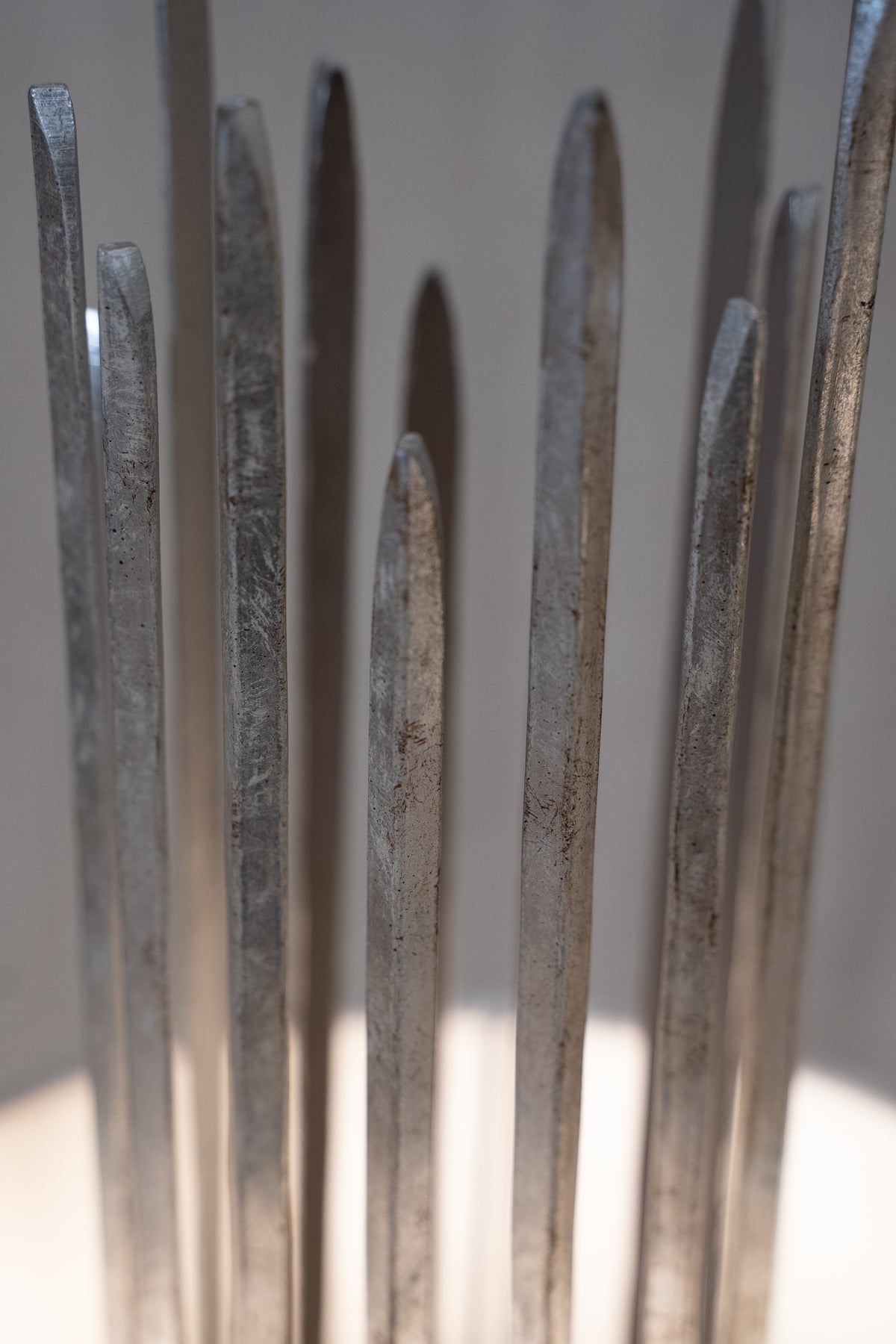Pair of Porta Romana Flynn Caged Lamps in Decayed Silver, supplied with original cylinder shades. Used condition with minor shade creasing and surface scratches.
