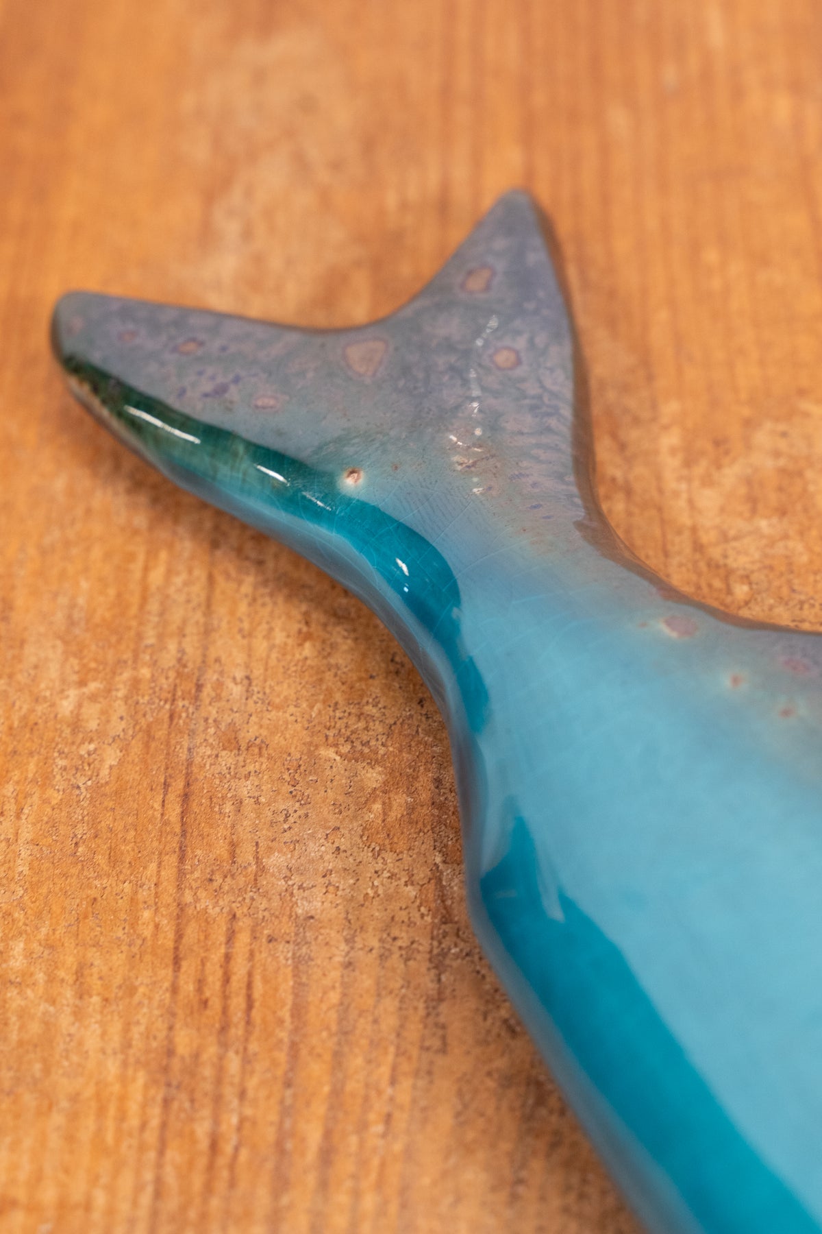 Hand-painted Portuguese ceramic sea bass wall decoration with unique surface details created using oxides and underglazes. Ideal for coastal interiors.