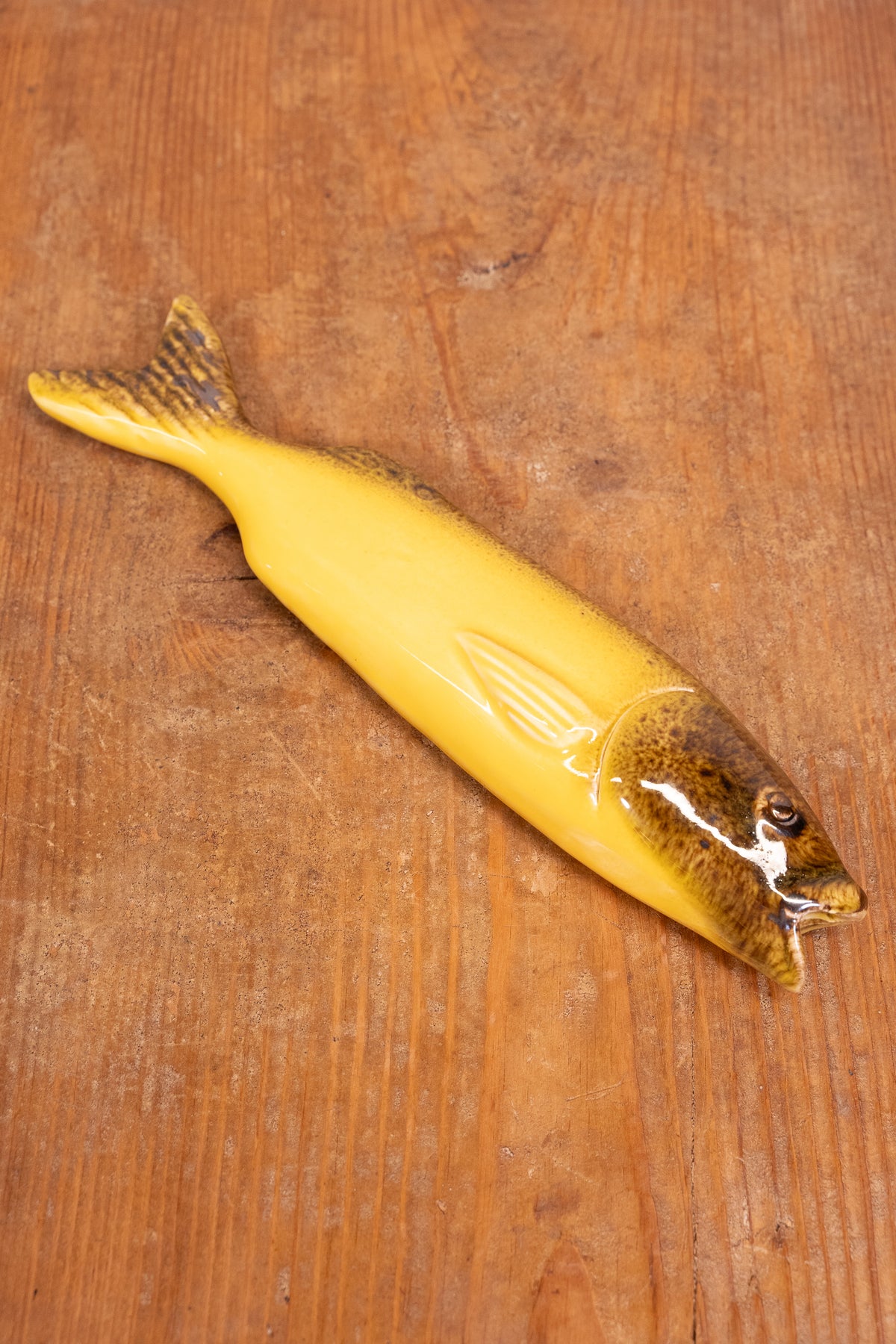 Hand-painted Portuguese ceramic sea bass wall decoration with unique surface details created using oxides and underglazes. Ideal for coastal interiors.