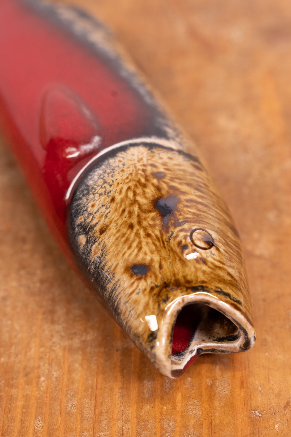 Hand-painted Portuguese ceramic sea bass wall decoration with unique surface details created using oxides and underglazes. Ideal for coastal interiors.