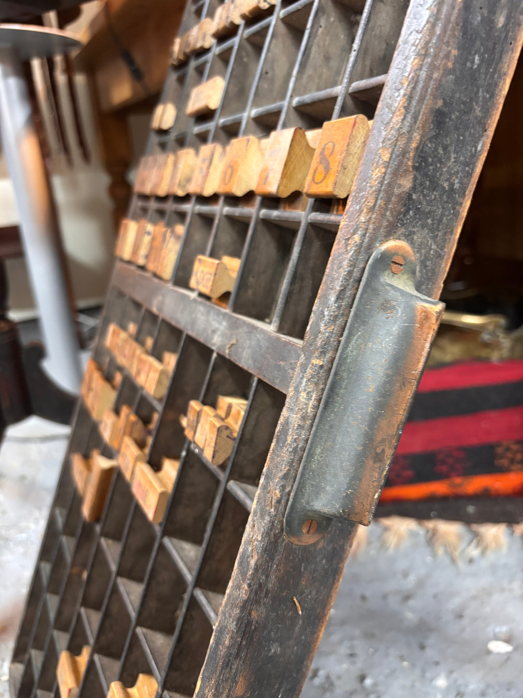 Vintage wooden type tray with wooden characters in a workshop setting