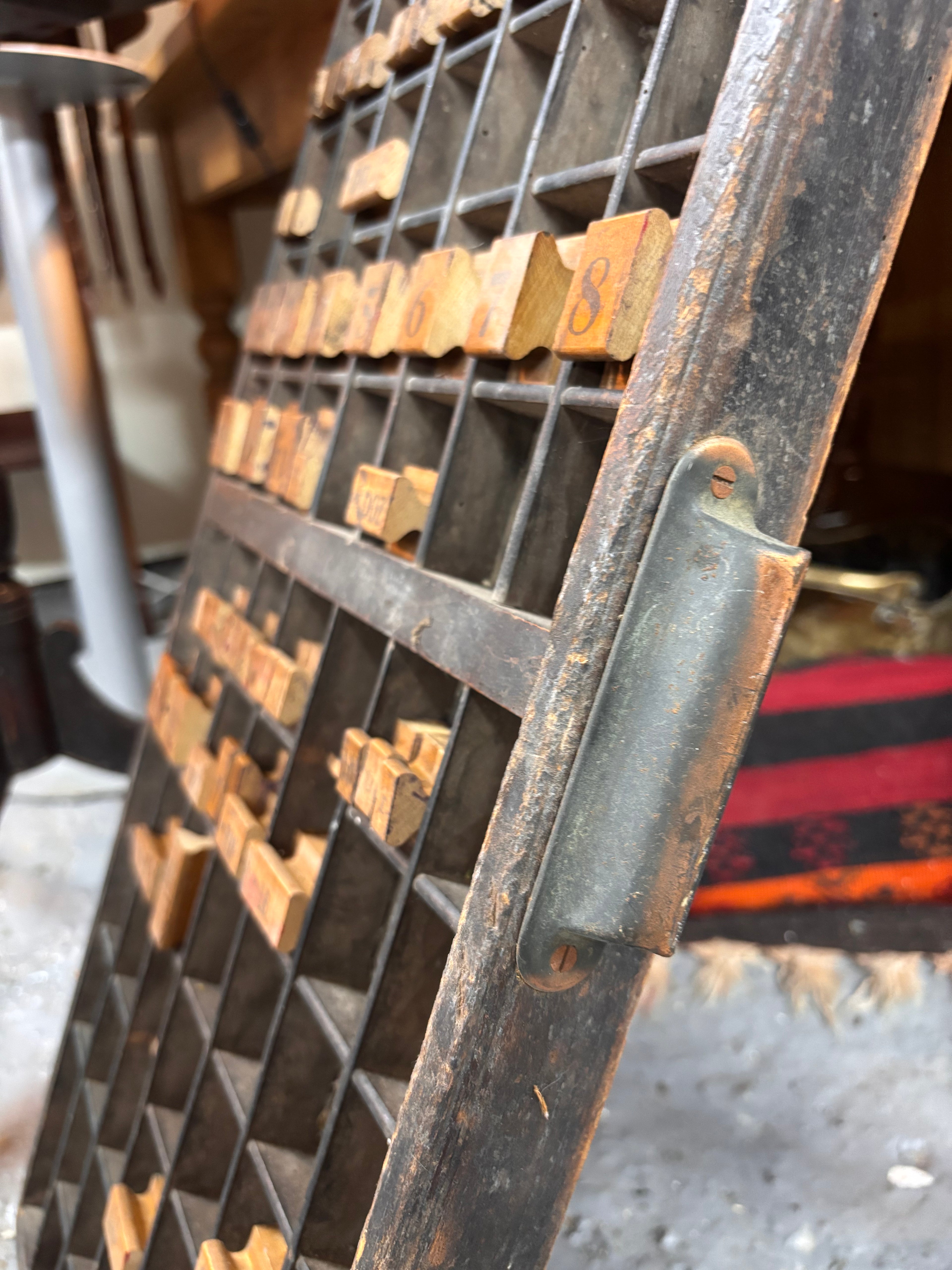 Vintage wooden type tray with wooden characters in a workshop setting