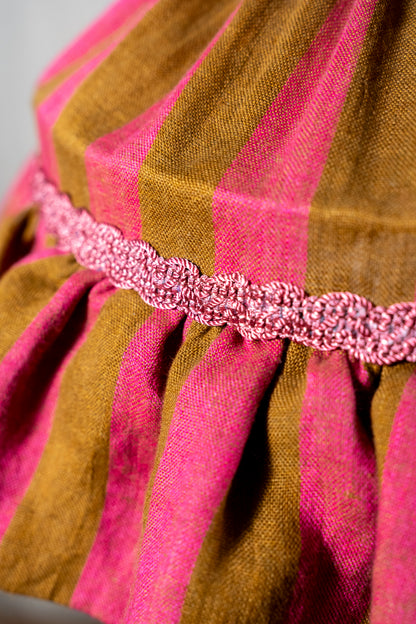 Handmade 12-inch linen carousel shade with raspberry and ochre stripes, vintage trim and pendant fitting. Cosy cottage style.