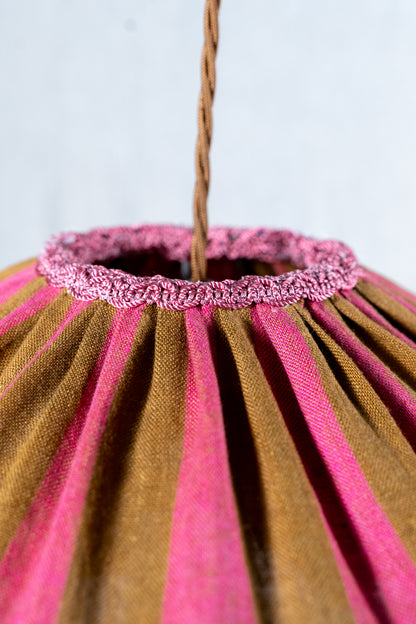 Handmade 12-inch linen carousel shade with raspberry and ochre stripes, vintage trim and pendant fitting. Cosy cottage style.