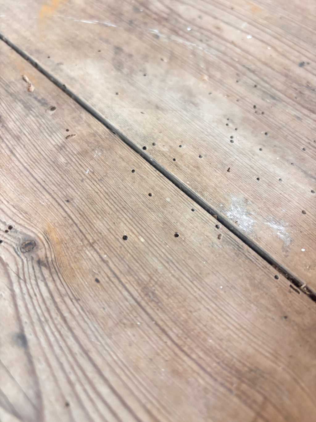 Close-up of a wooden surface with visible grain and texture