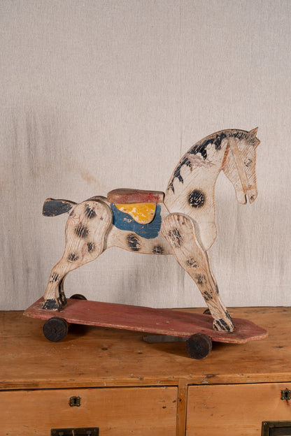 Vintage scratch-built wooden pull-along horse, possibly of French origin. A characterful folk-art toy for collectors or decorative display.
