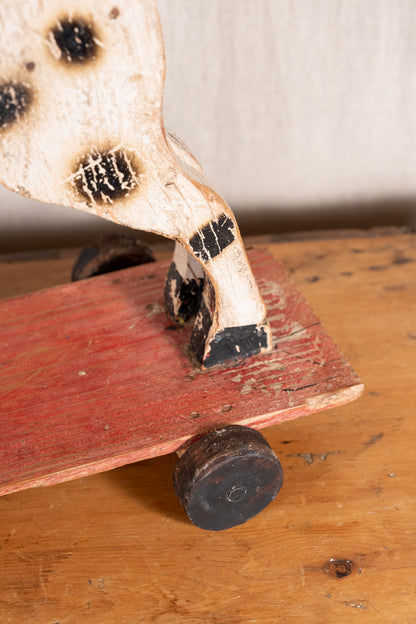 Vintage scratch-built wooden pull-along horse, possibly of French origin. A characterful folk-art toy for collectors or decorative display.
