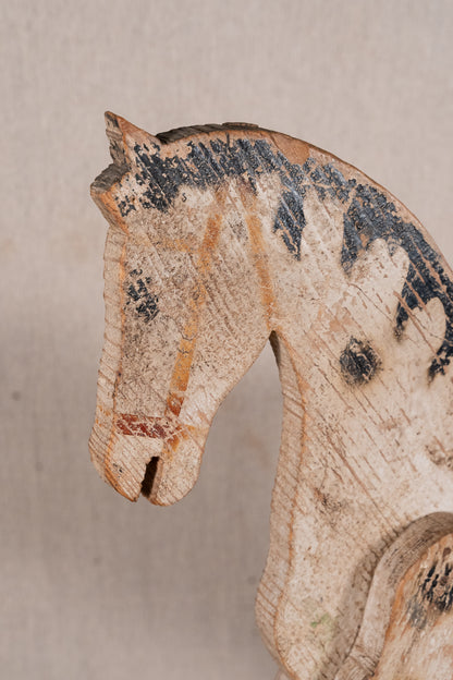 Vintage scratch-built wooden pull-along horse, possibly of French origin. A characterful folk-art toy for collectors or decorative display.