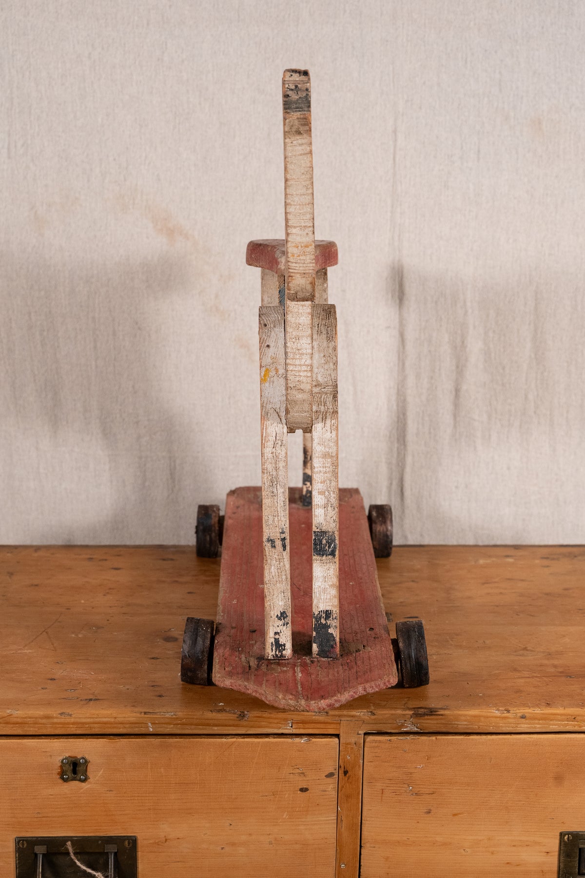 Vintage scratch-built wooden pull-along horse, possibly of French origin. A characterful folk-art toy for collectors or decorative display.