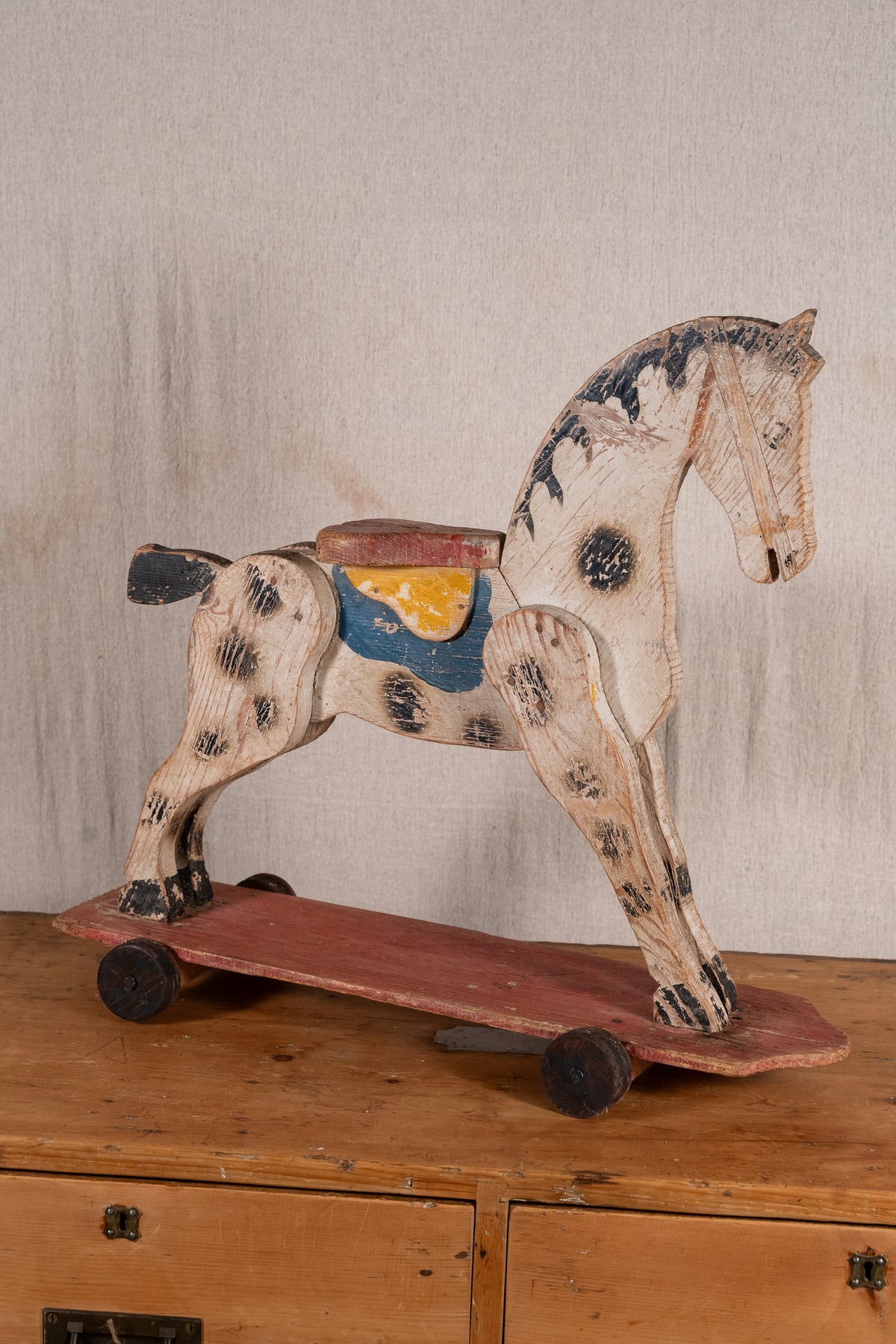 Vintage scratch-built wooden pull-along horse, possibly of French origin. A characterful folk-art toy for collectors or decorative display.