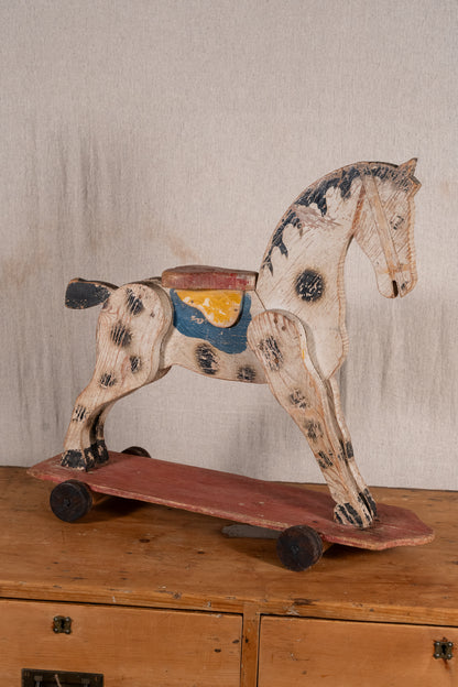 Vintage scratch-built wooden pull-along horse, possibly of French origin. A characterful folk-art toy for collectors or decorative display.