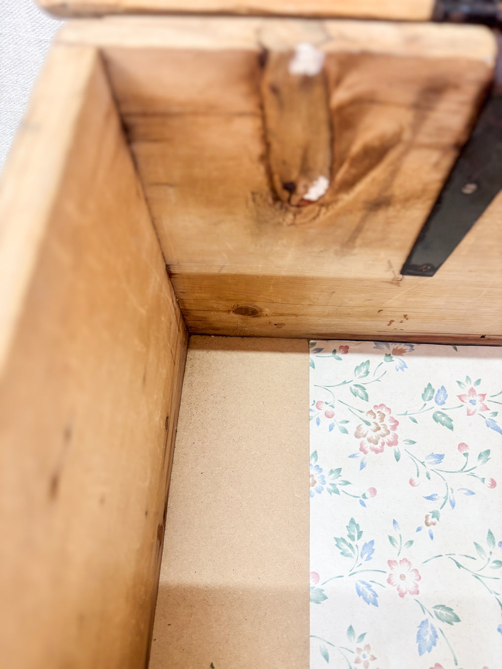 Wooden box with a floral patterned paper inside