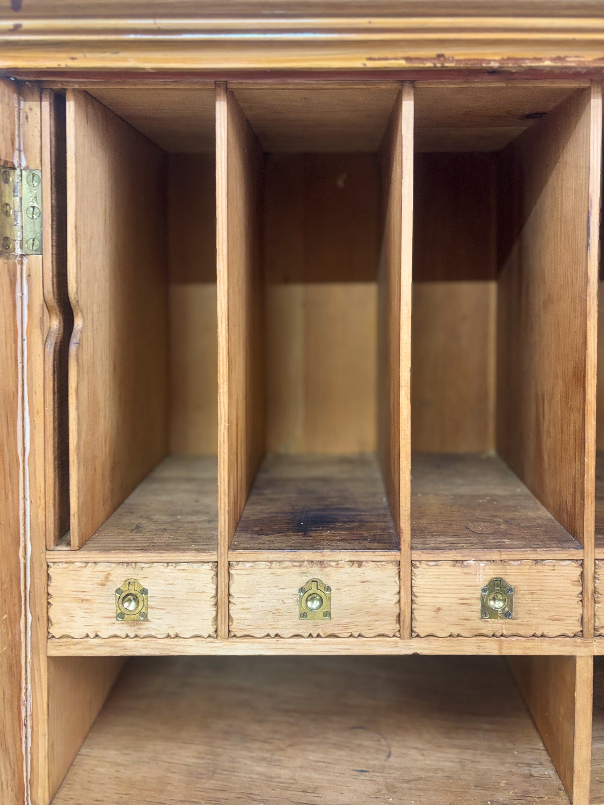 Wooden cabinet with three drawers and a shelf inside