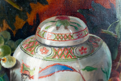 Close-up of a hand-painted ceramic lidded jar with intricate floral and geometric patterns in red, green, and blue on a white base, set against a dark, painterly background.