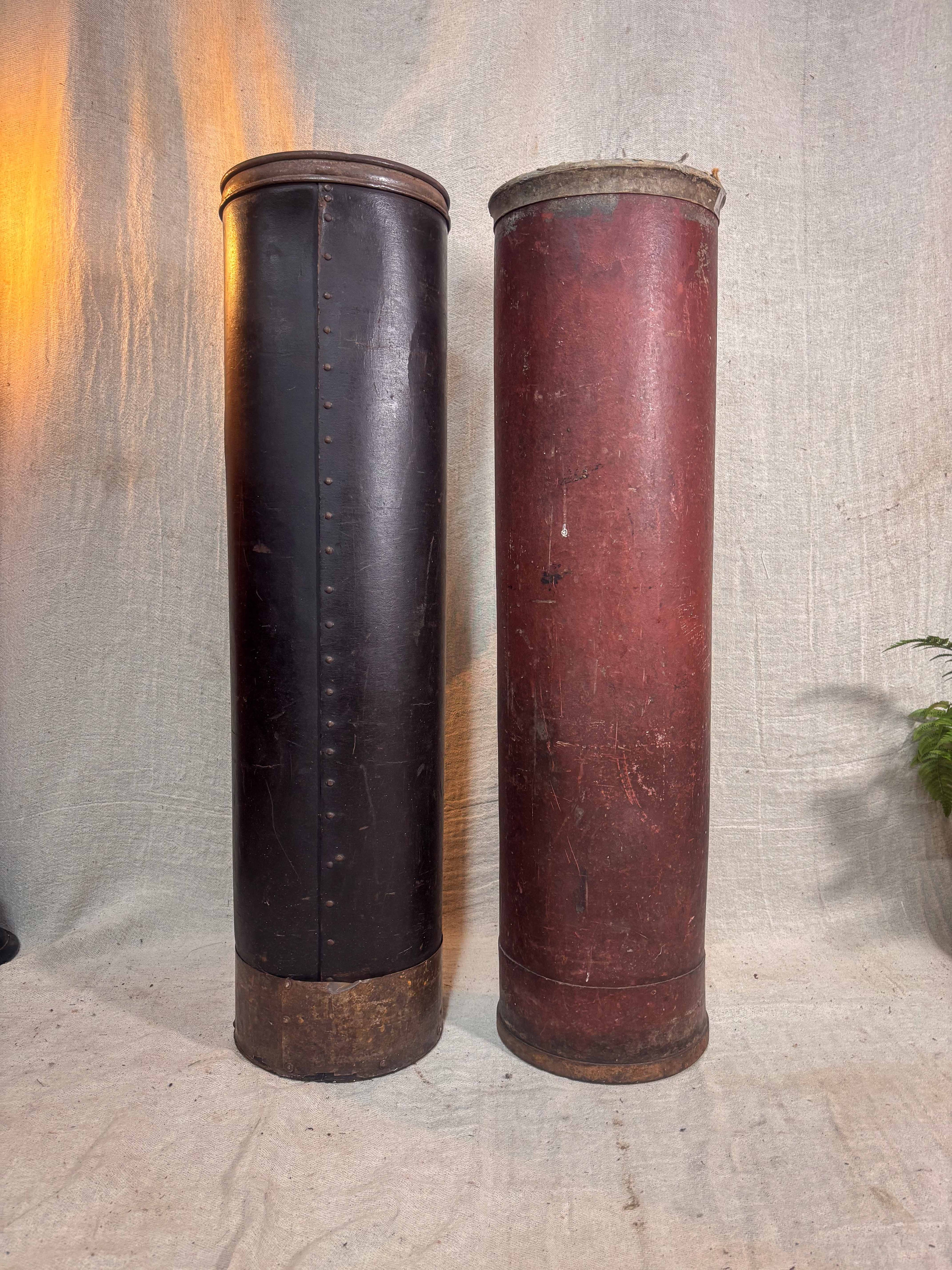 Two cylindrical cases on a textured surface with a neutral background