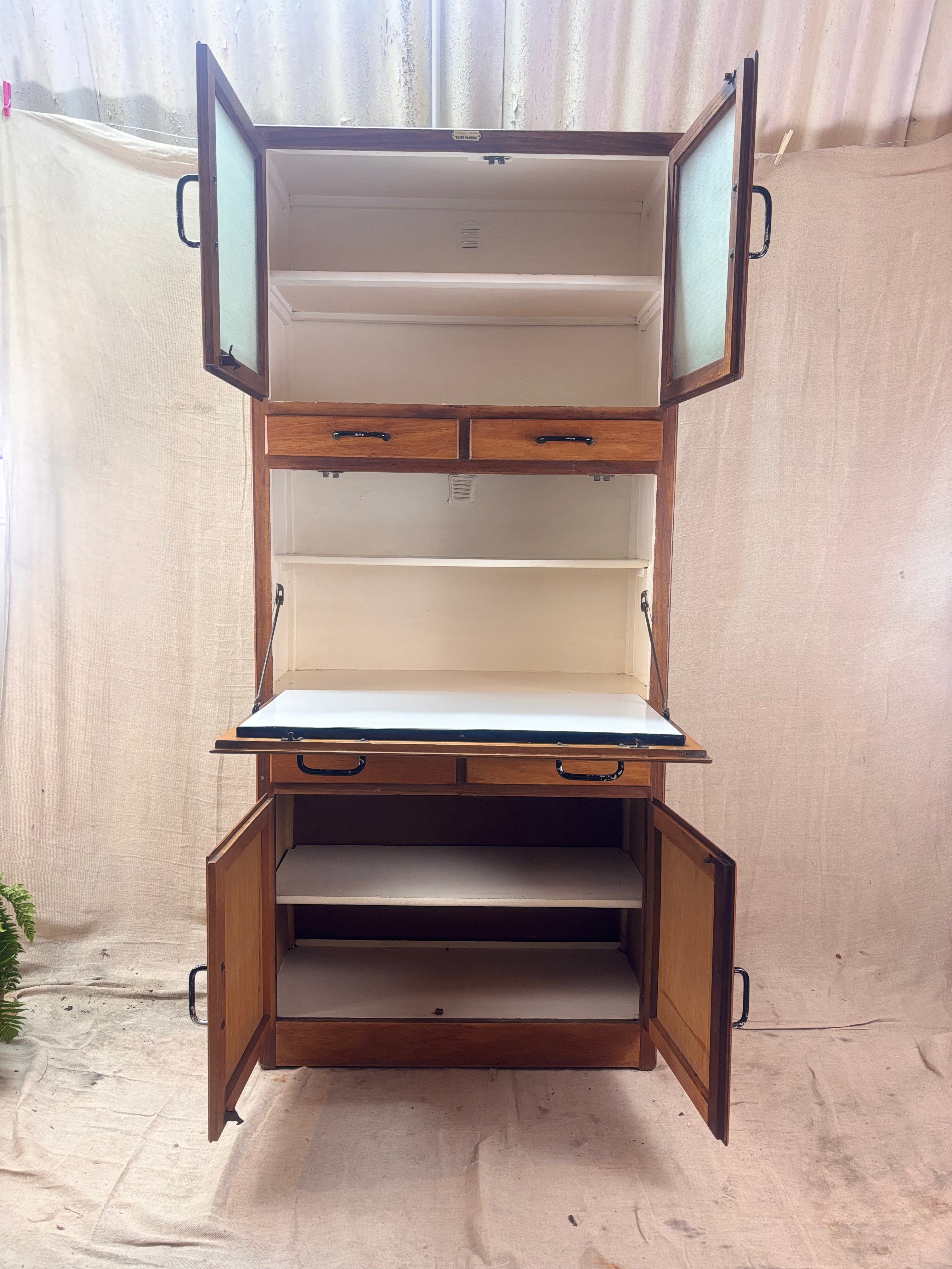 Wooden cabinet with open doors on a plain background