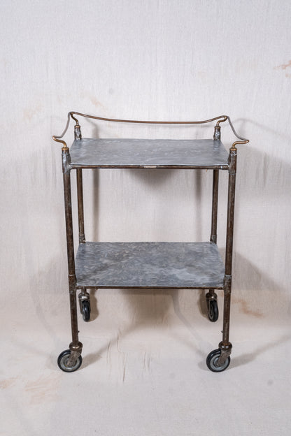 Vintage British medical trolley dating from the 1920s to 1940s, with tiered galvanised metal shelves, tubular steel frame and original swivel castors.