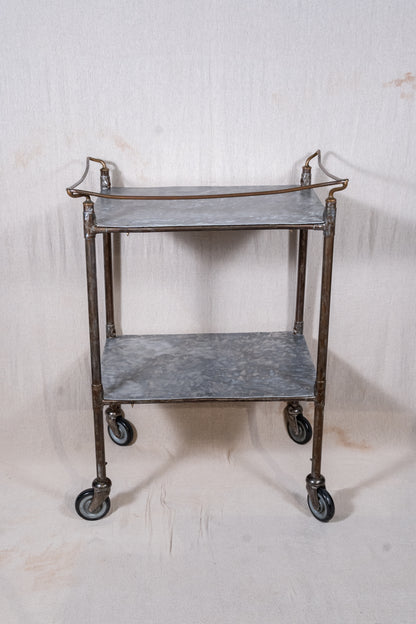 Vintage British medical trolley dating from the 1920s to 1940s, with tiered galvanised metal shelves, tubular steel frame and original swivel castors.