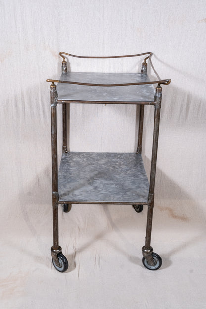 Vintage British medical trolley dating from the 1920s to 1940s, with tiered galvanised metal shelves, tubular steel frame and original swivel castors.