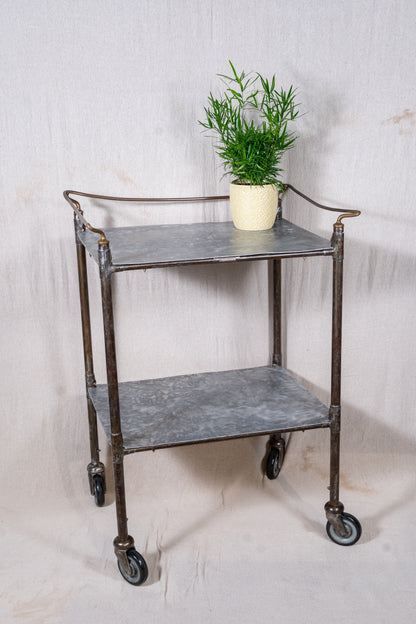 Vintage British medical trolley dating from the 1920s to 1940s, with tiered galvanised metal shelves, tubular steel frame and original swivel castors.