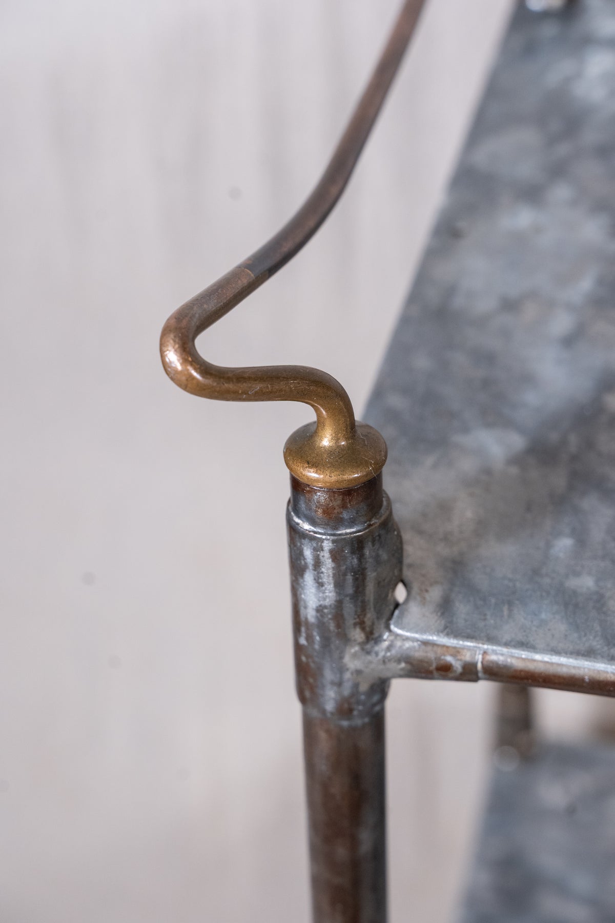 Vintage British medical trolley dating from the 1920s to 1940s, with tiered galvanised metal shelves, tubular steel frame and original swivel castors.