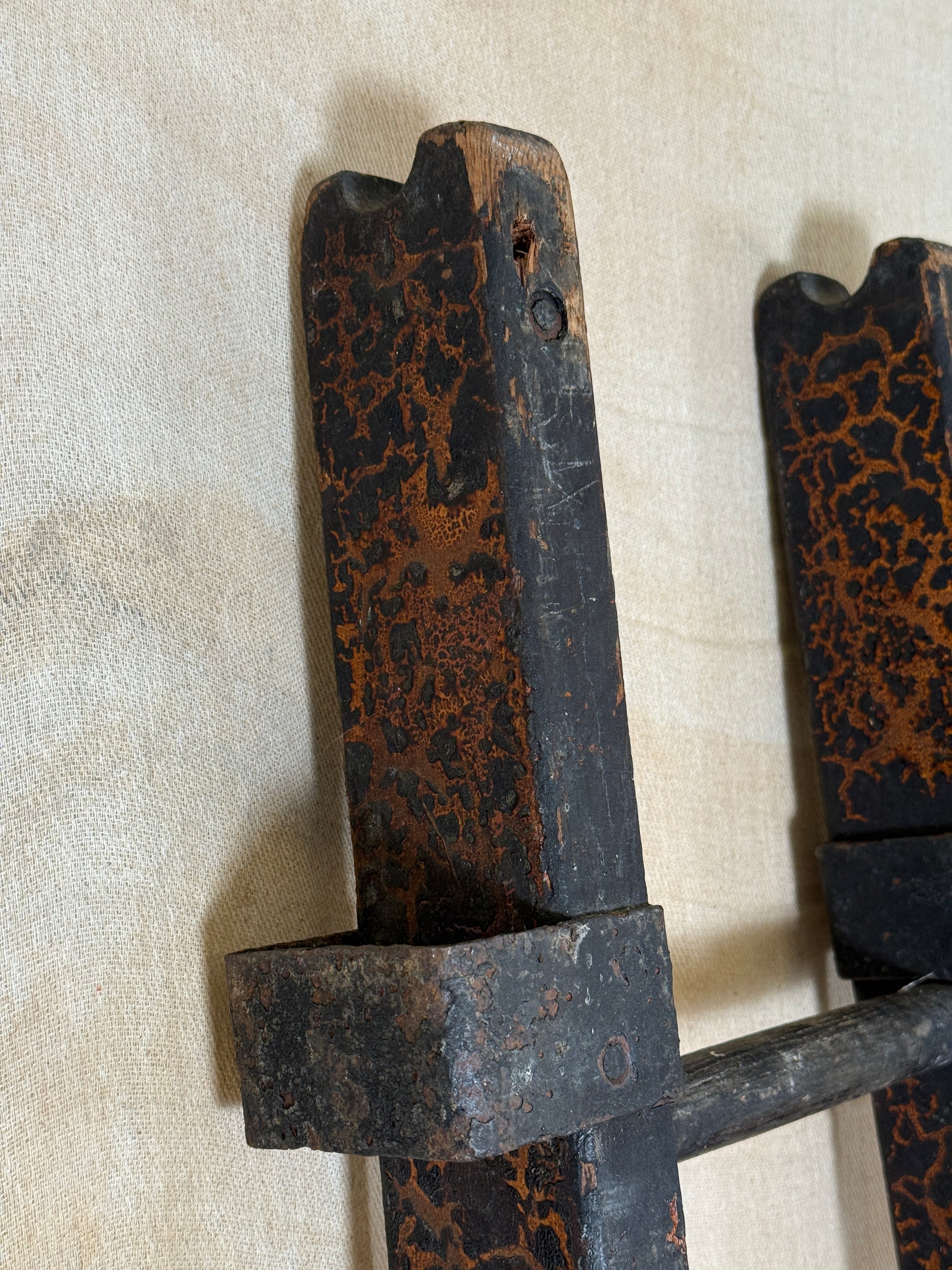 Pair of vintage wooden ladders with worn black paint