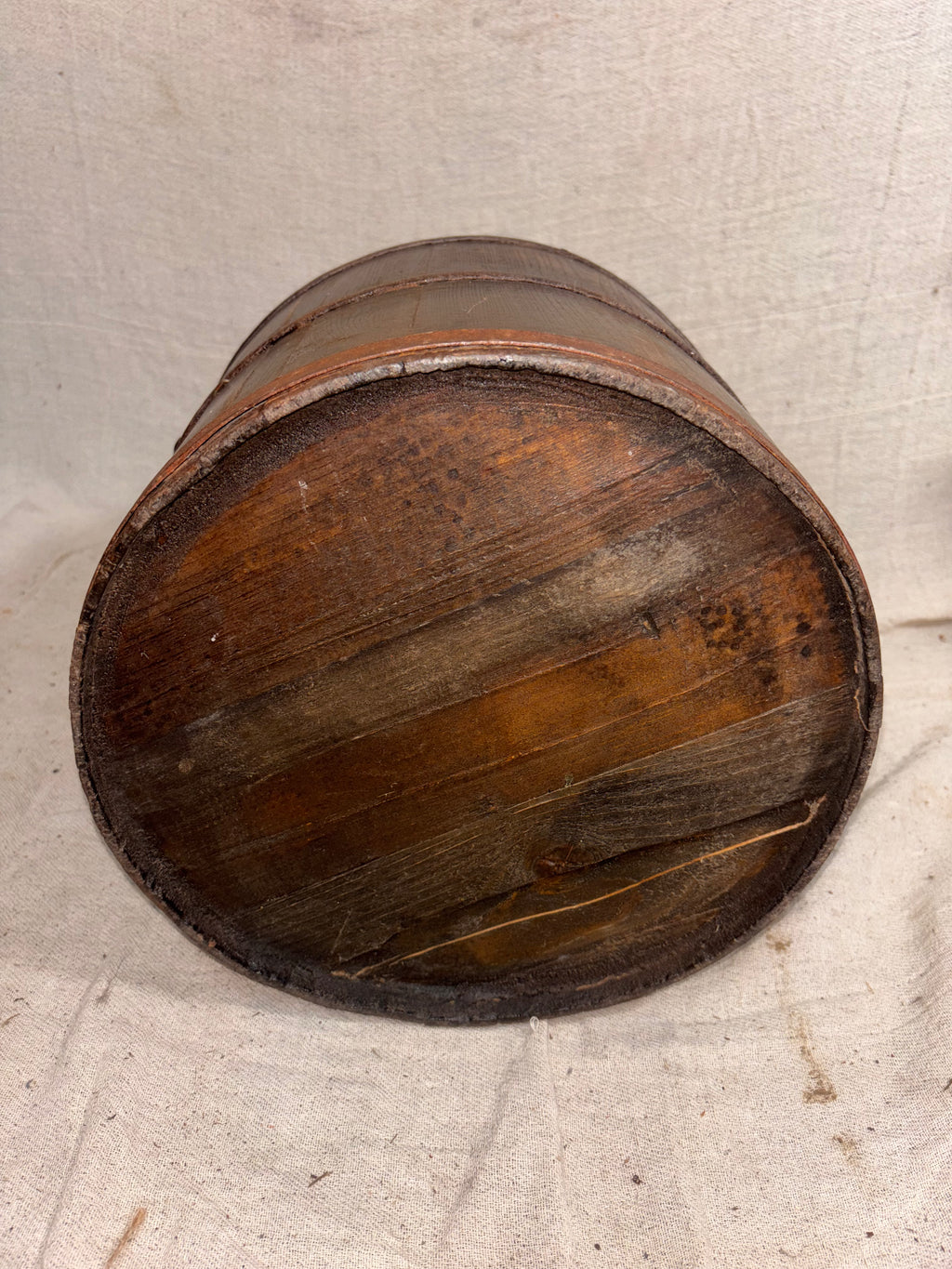 Wooden bucket on a textured surface