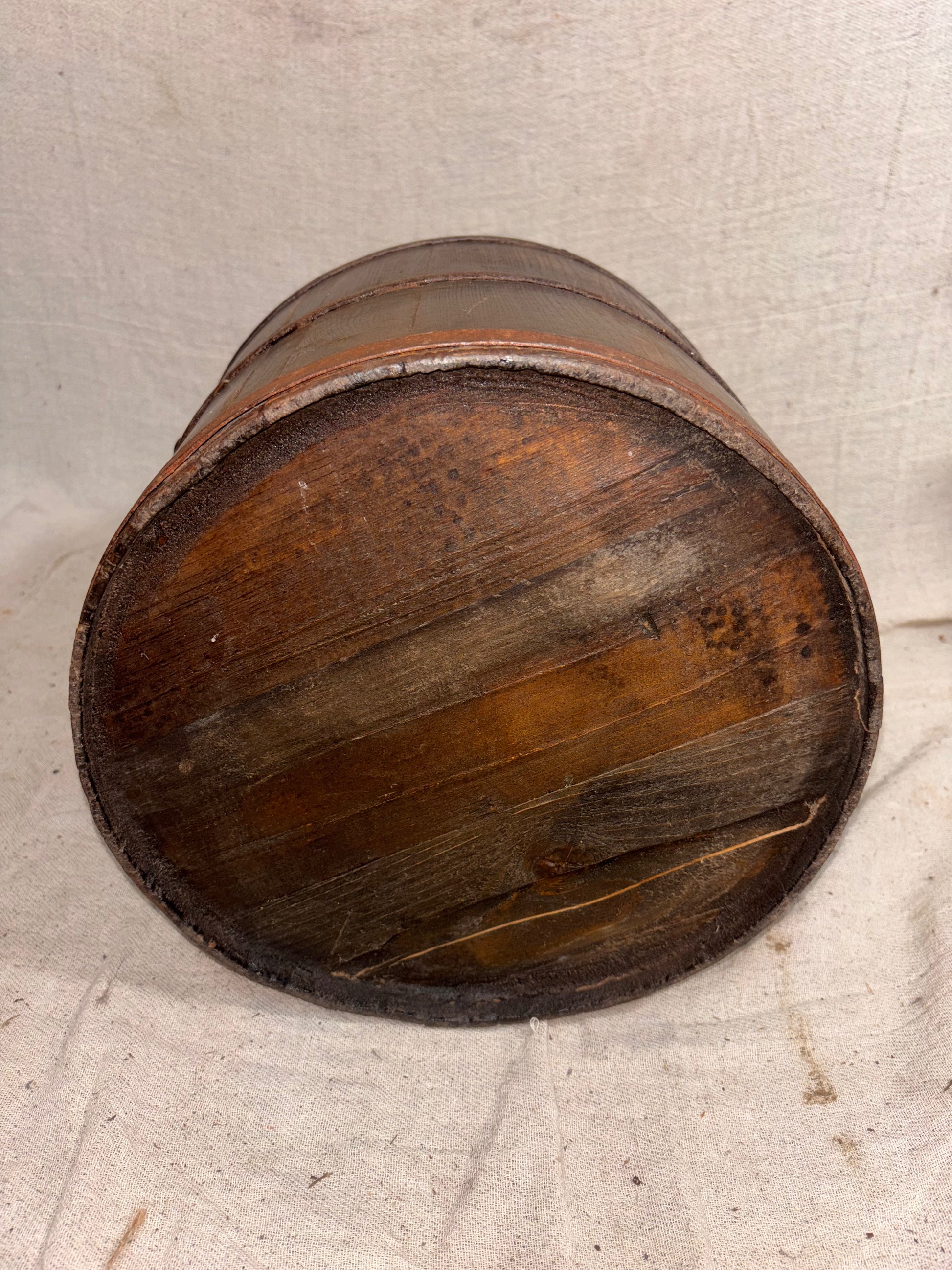 Wooden bucket on a textured surface