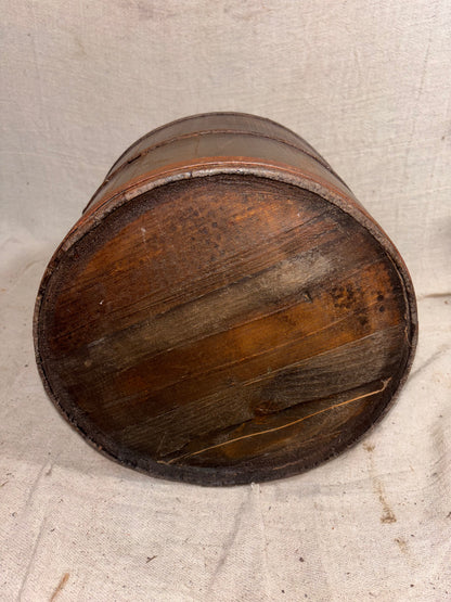 Wooden bucket on a textured surface