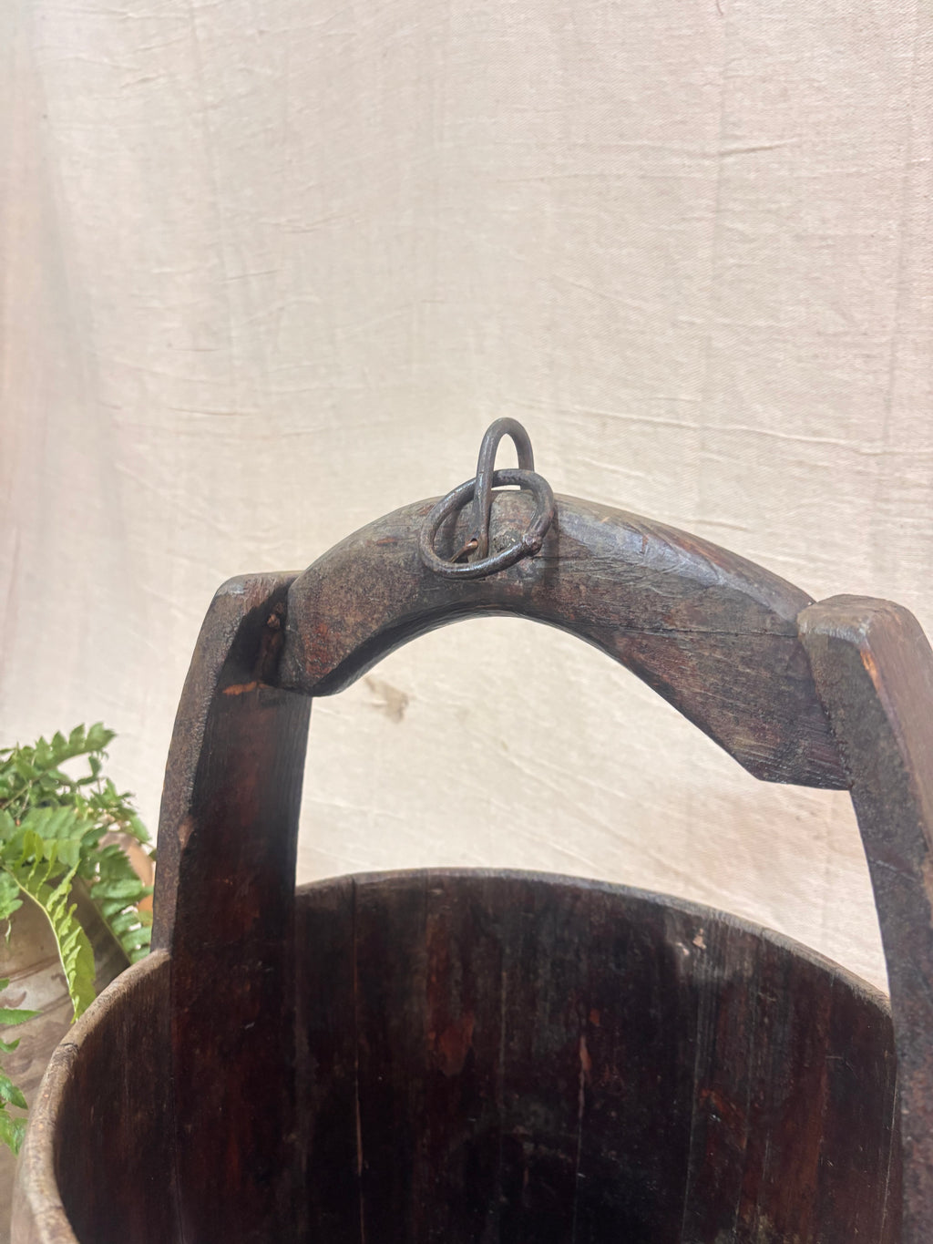 Vintage wooden well bucket with metal bands