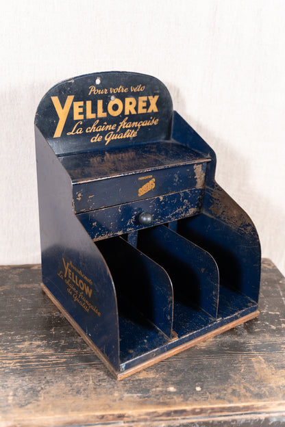 Vintage French metal chain display cabinet by Sedis, with original Yellorex bicycle and Yellow motorcycle chain advertising, storage slots and central drawer.