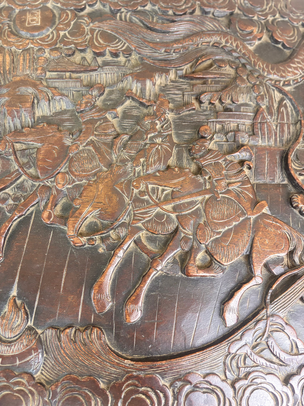 A wood carving of a horse and a dragon
