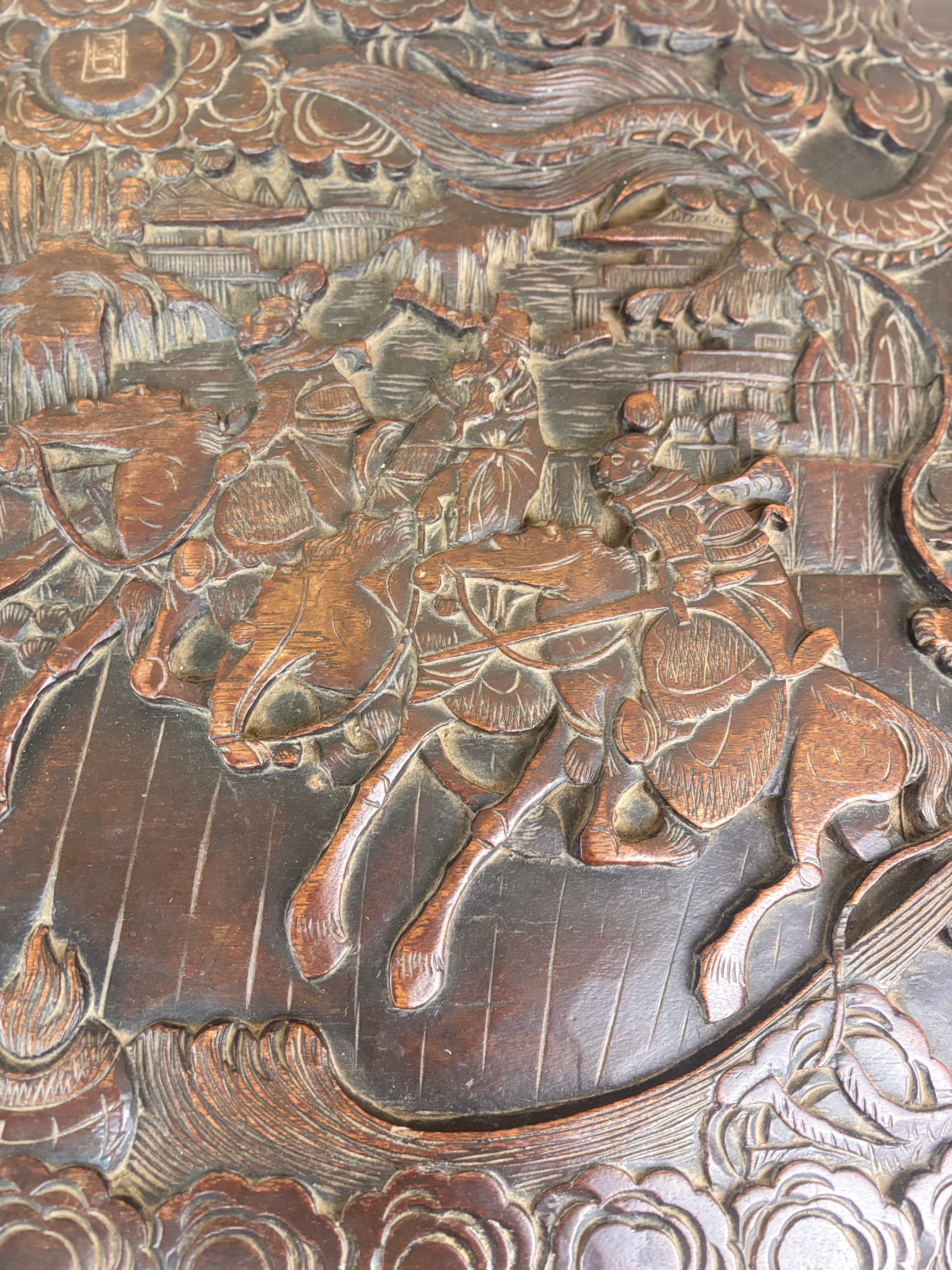 A wood carving of a horse and a dragon