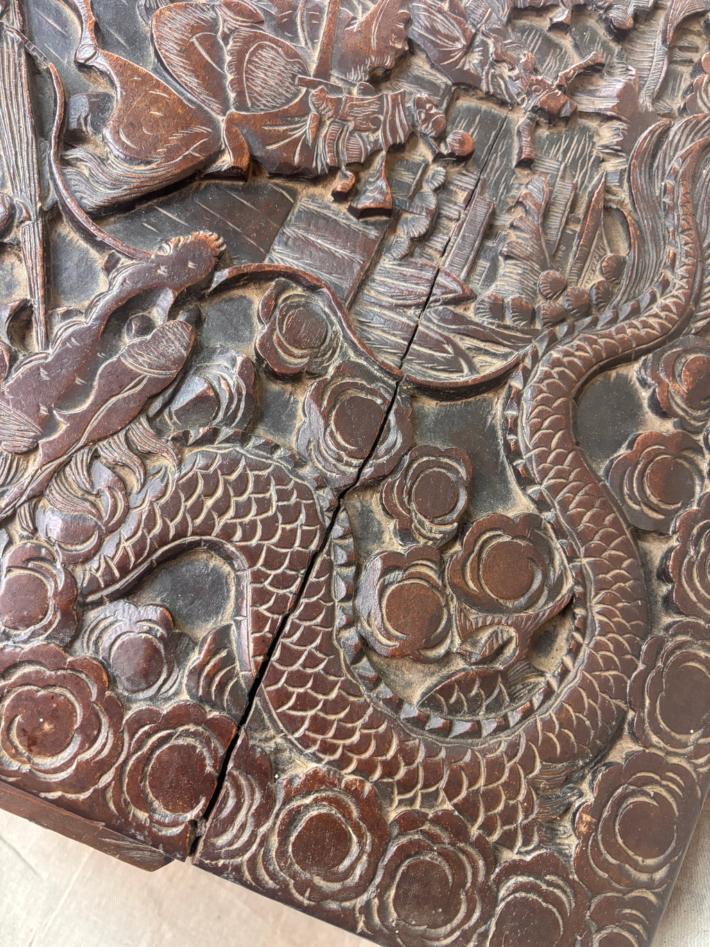 A carved wooden panel  