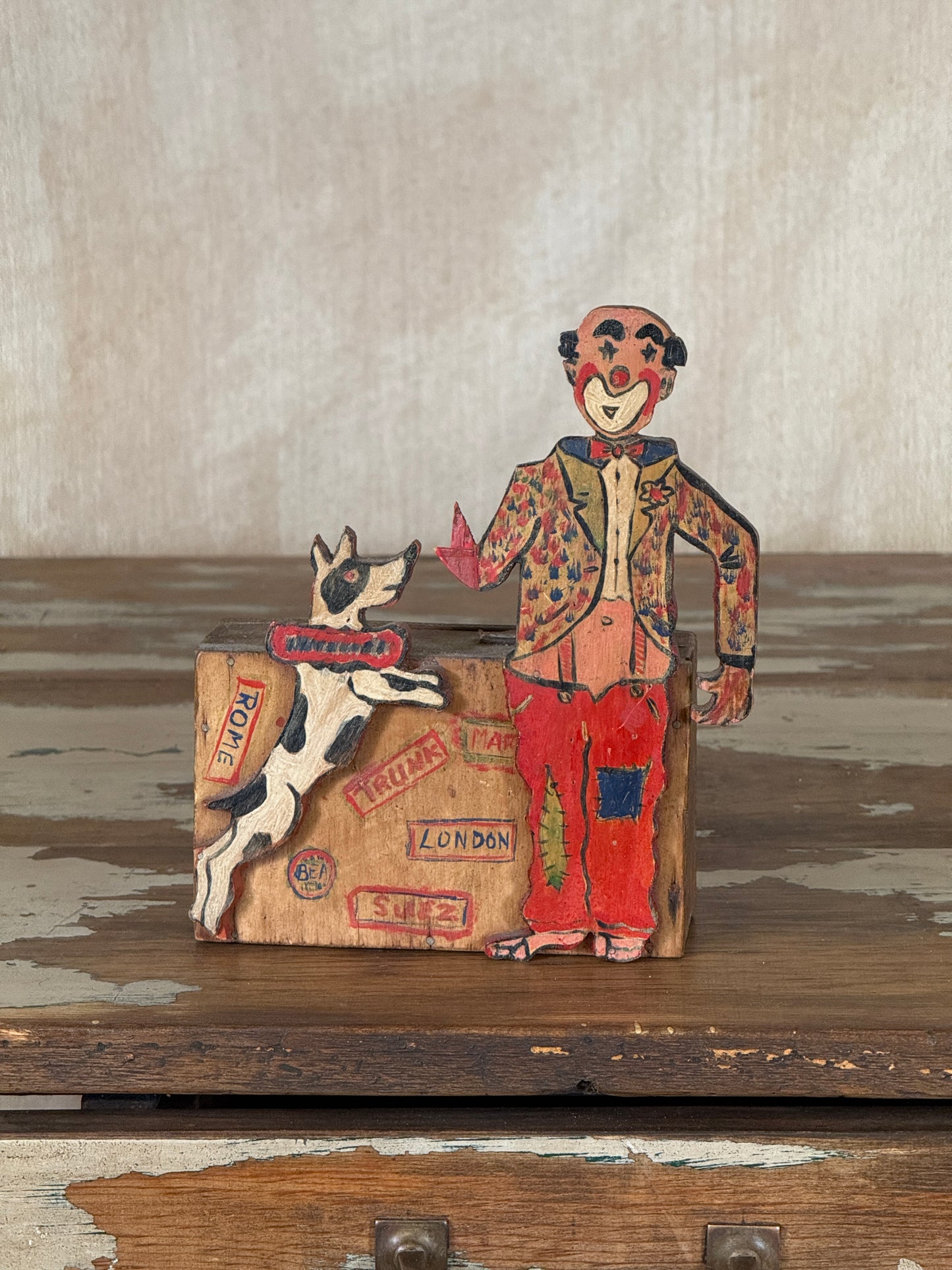 Hand-crafted folk art wooden clown money box