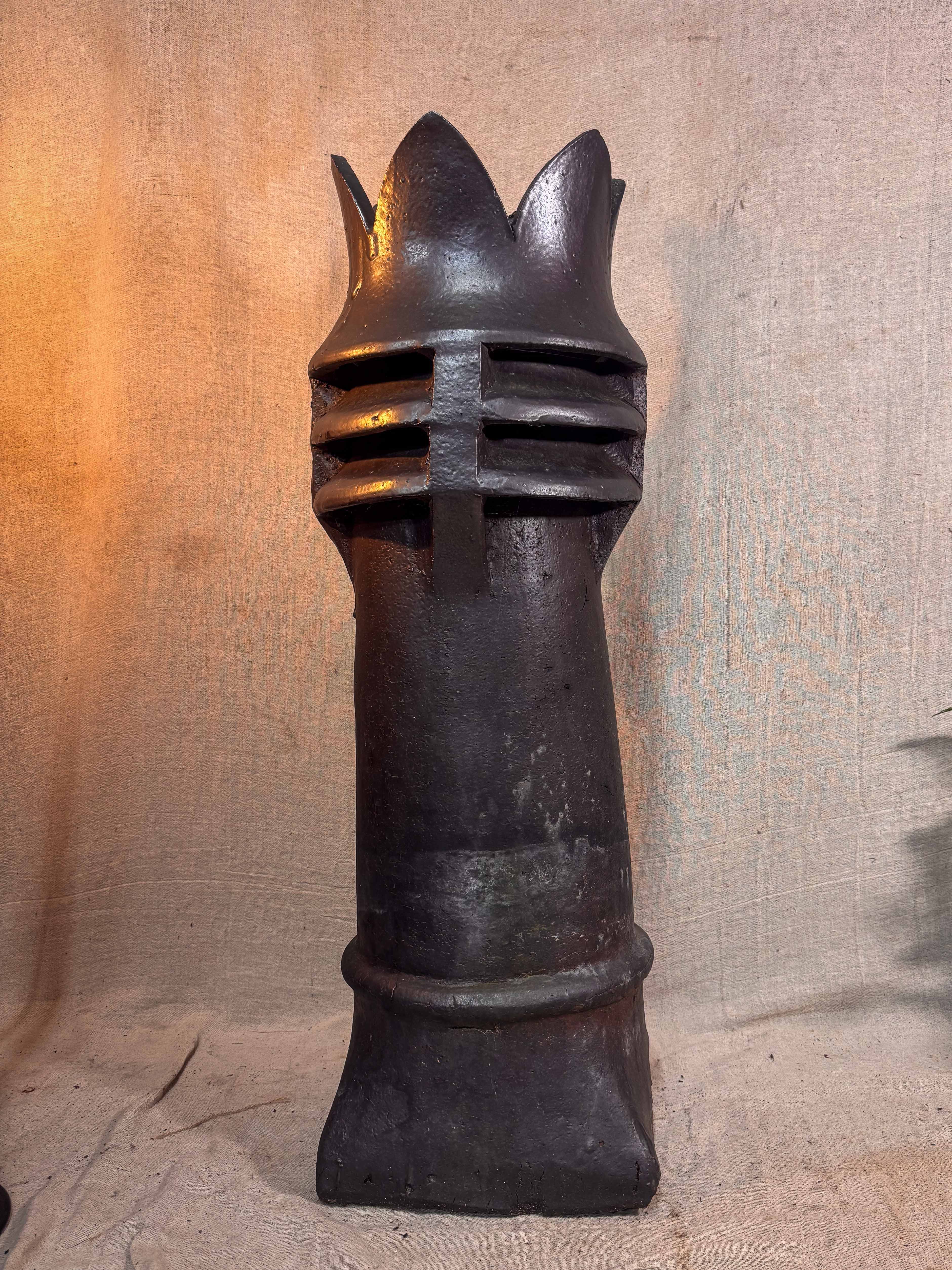 Decorative crown top chimney on a textured beige background