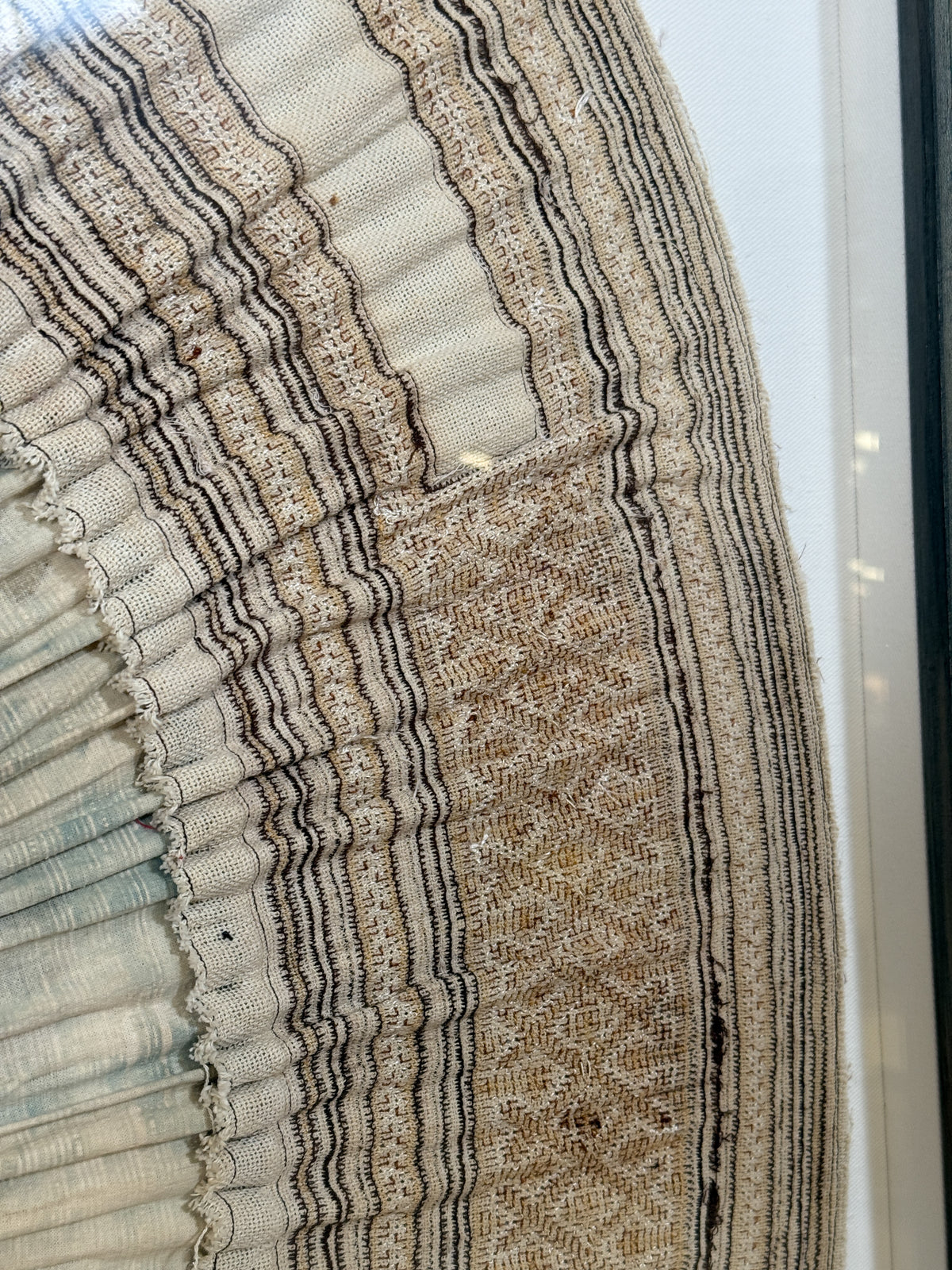 framed antique Miao tribal skirt
