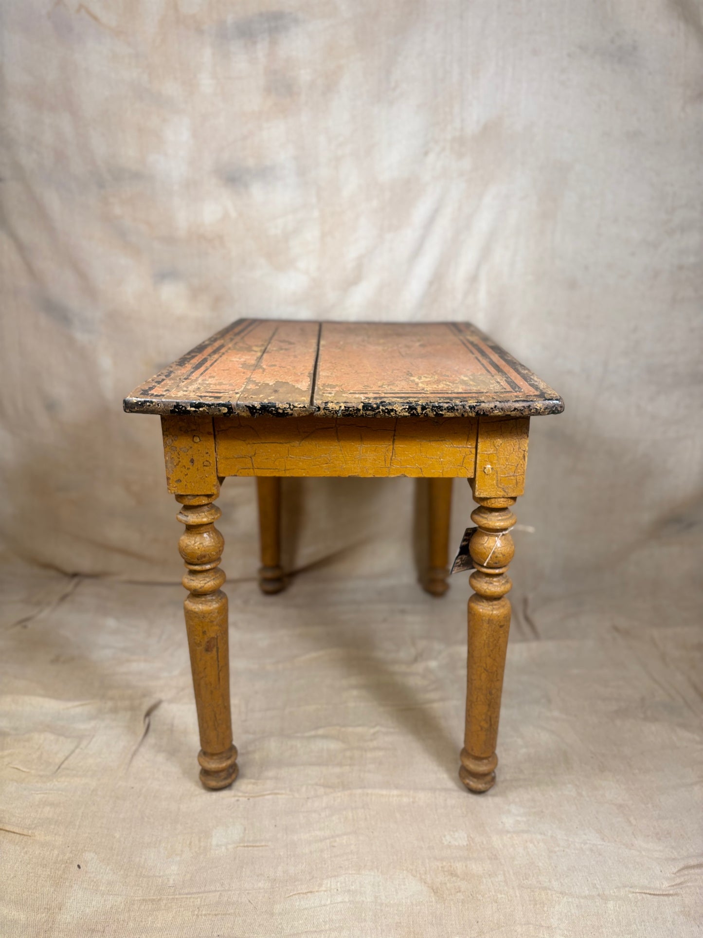 Wooden table with a checkered surface on a plain background