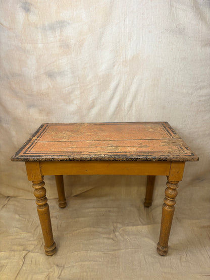 Vintage wooden table with a worn surface on a plain background