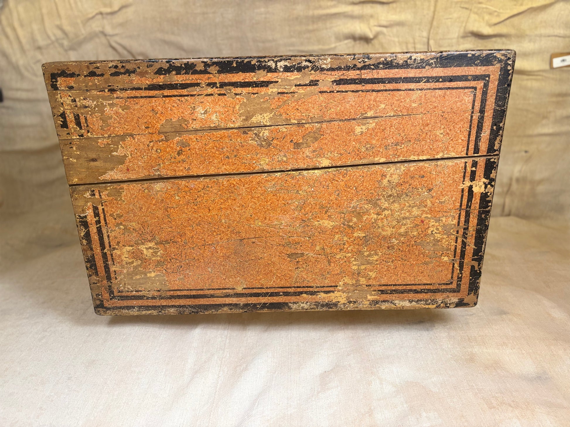 Table top weathered orange and black surface on a neutral background
