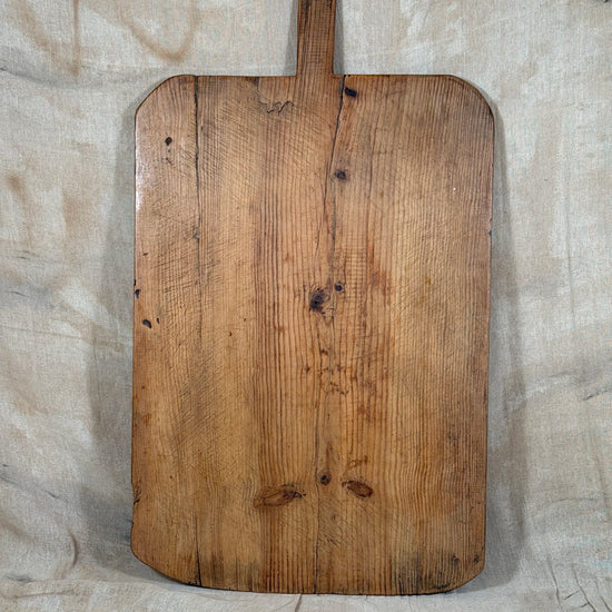 A huge antique wooden serving board. 