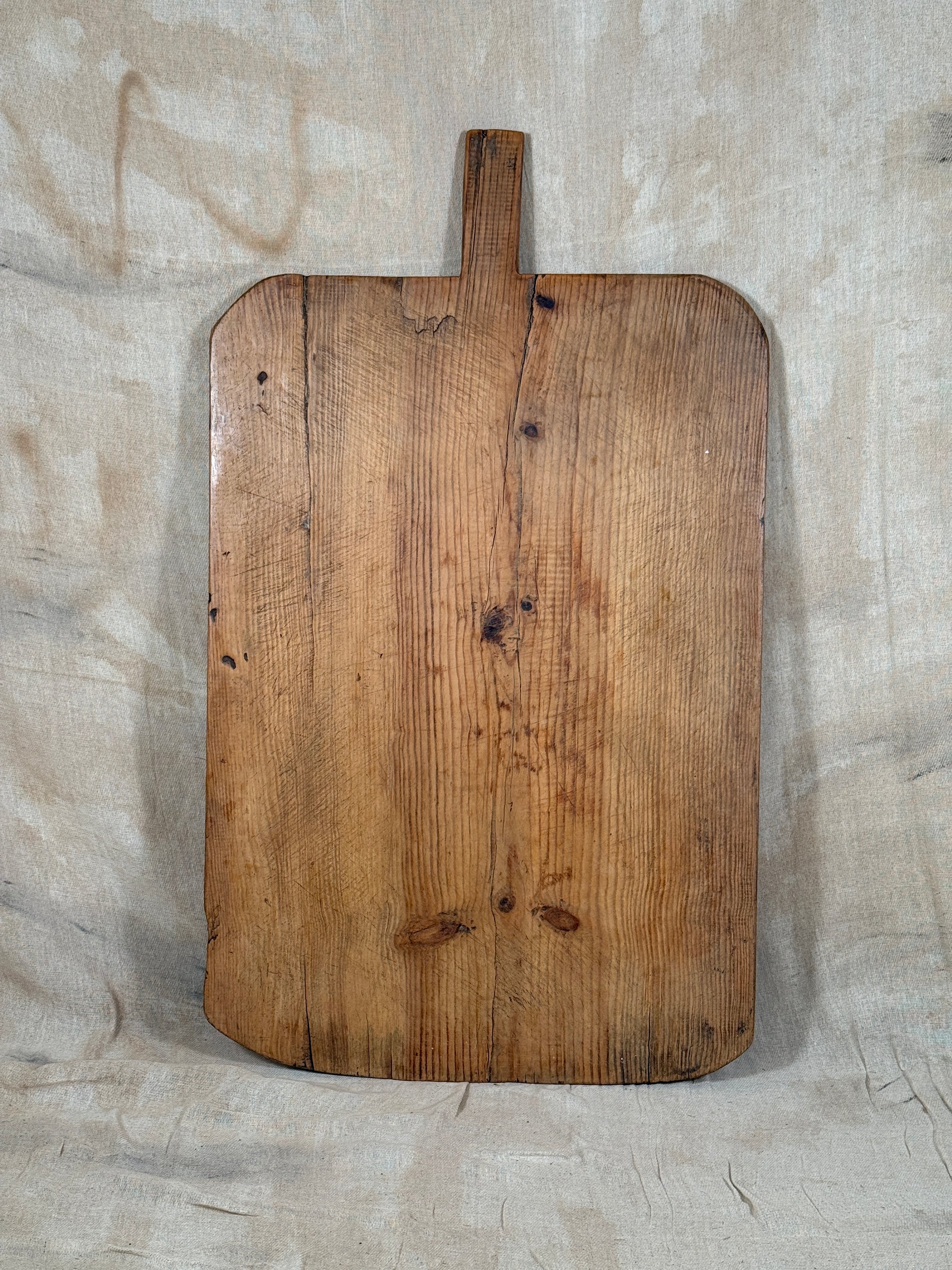 A huge antique wooden serving board. 