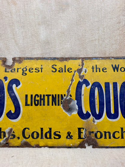 Vintage sign for Veno's Lightning Cough and Cold remedy on a textured beige background
