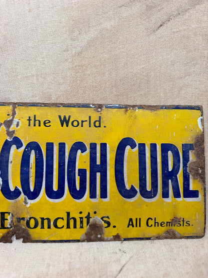 Vintage sign for Veno's Lightning Cough and Cold remedy on a textured beige background