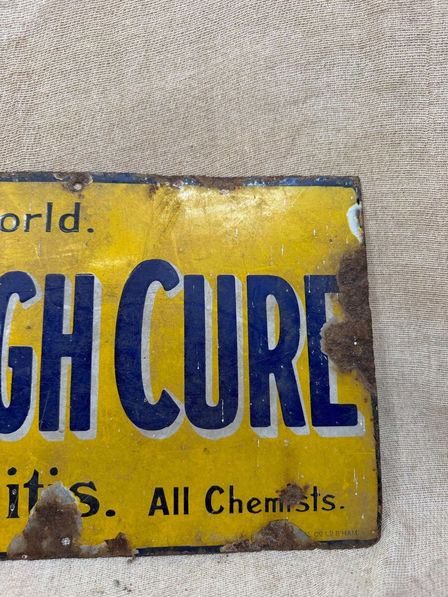 Vintage sign for Veno's Lightning Cough and Cold remedy on a textured beige background