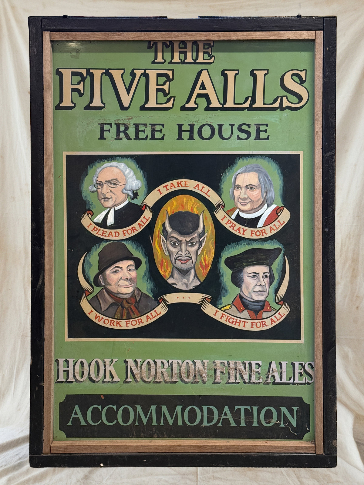 A vintage framed pub sign for 'The Five Alls Free House' advertising Hook Norton Fine Ales, featuring five illustrated portraits of historical figures on a green and black background.